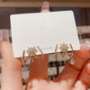 Gold-plated zircon needle claw earrings