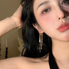 Golden long tassel earrings
