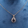 Gold-Toned Necklace with Black Teardrop Pendant