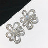 Silver flower stud earring
