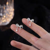 Rhinestone bow stud earrings