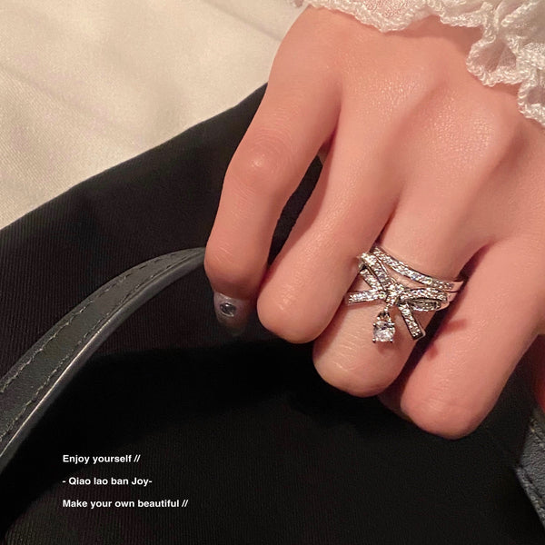 Bow-design ring with gemstones