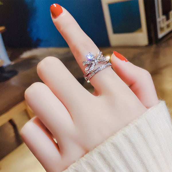 Bow-design ring with gemstones