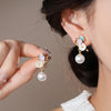 Flower pearl dangle earrings