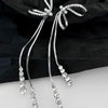 White bow long tassel earrings