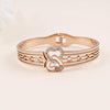 Rose Gold Plated Bracelet with Interlocking Heart Design and Crystal Accents".