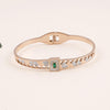 Rose Gold Plated Geometric Bracelet with Green Gemstone and Crystals".