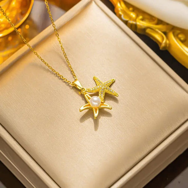 Golden star necklace with white pearl