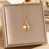 Golden star necklace with white pearl