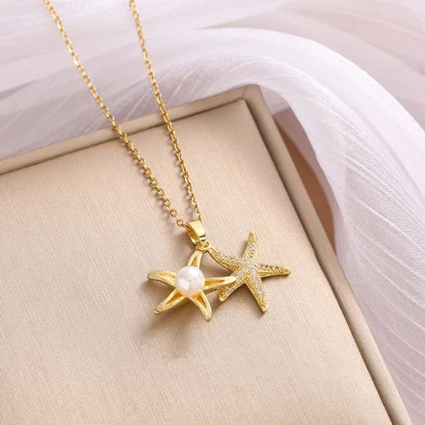 Golden star necklace with white pearl