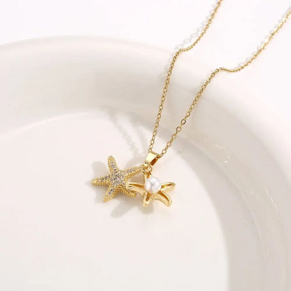 Golden star necklace with white pearl