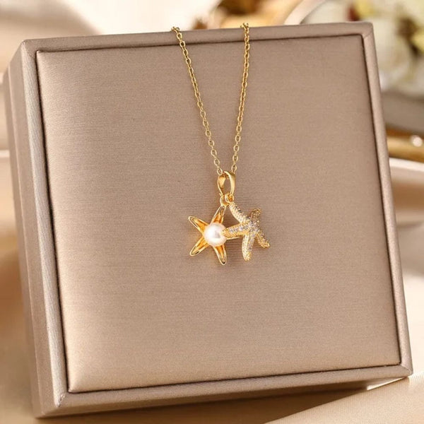 Golden star necklace with white pearl