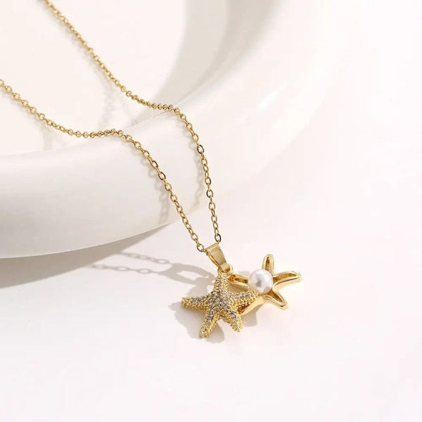 Golden star necklace with white pearl