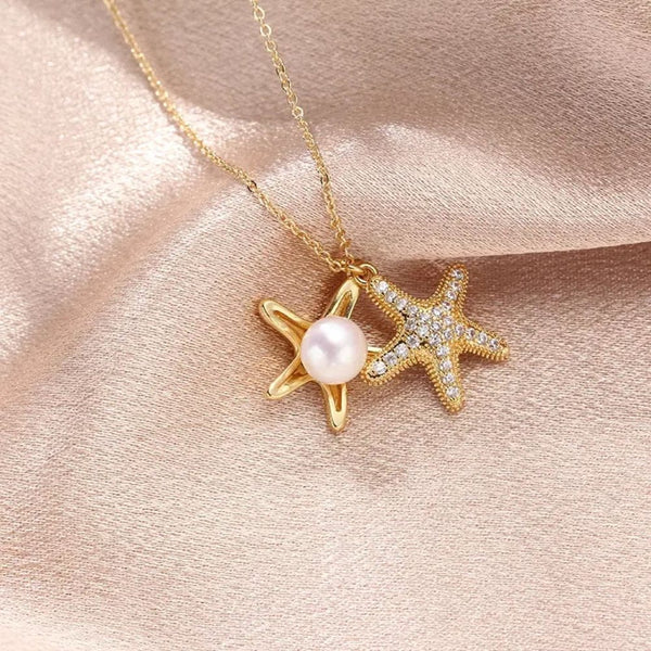 Golden star necklace with white pearl