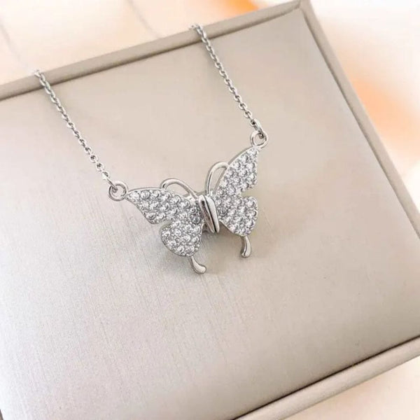 Silver butterfly white stone necklace