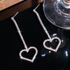 Heart shaped diamond dangle earrings