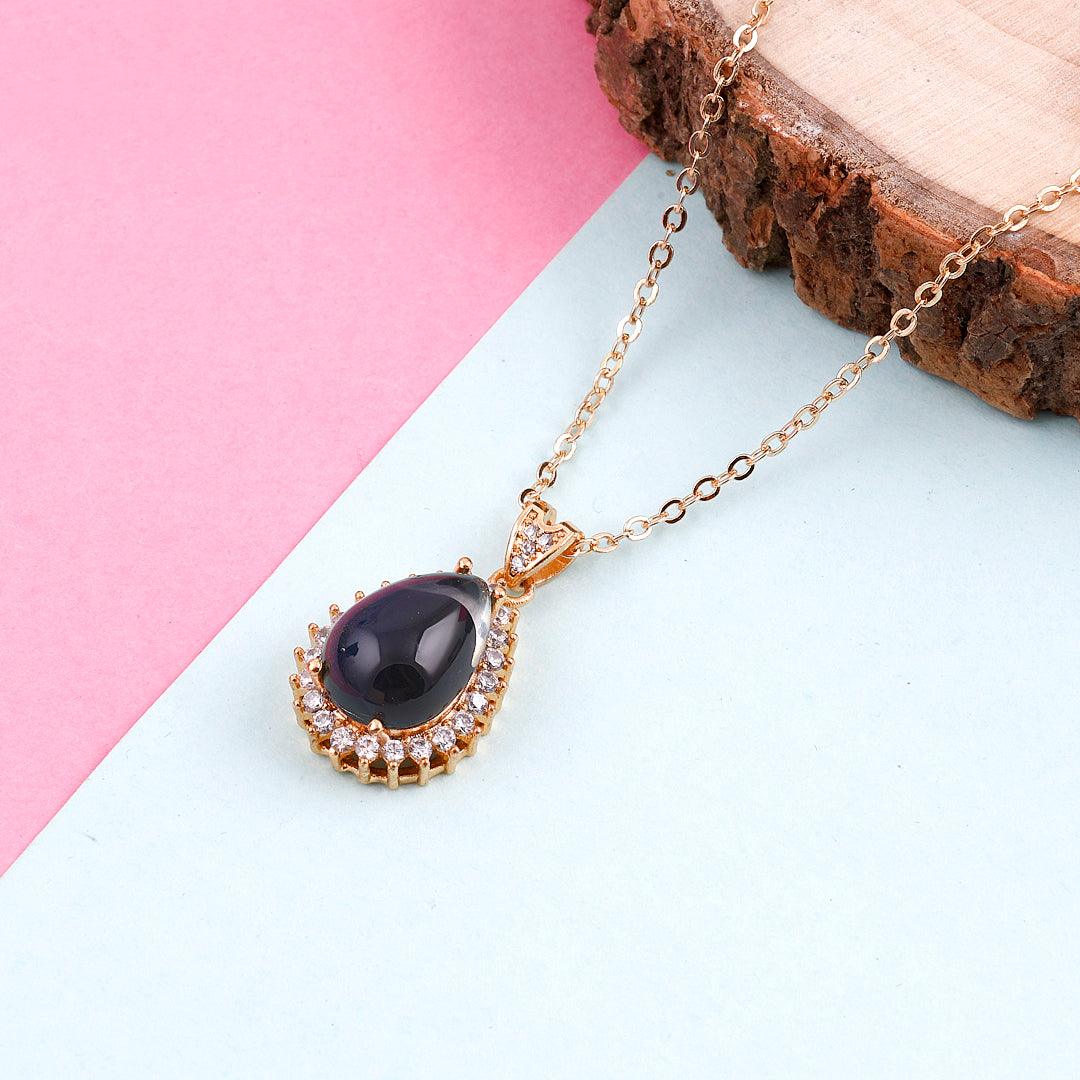 Gold-Toned Necklace with Black Teardrop Pendant