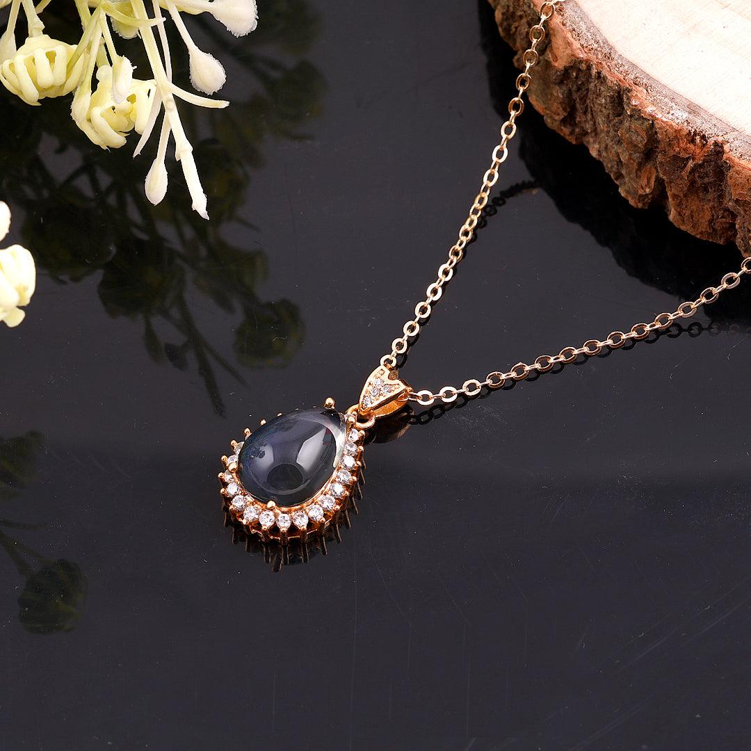 Gold-Toned Necklace with Black Teardrop Pendant