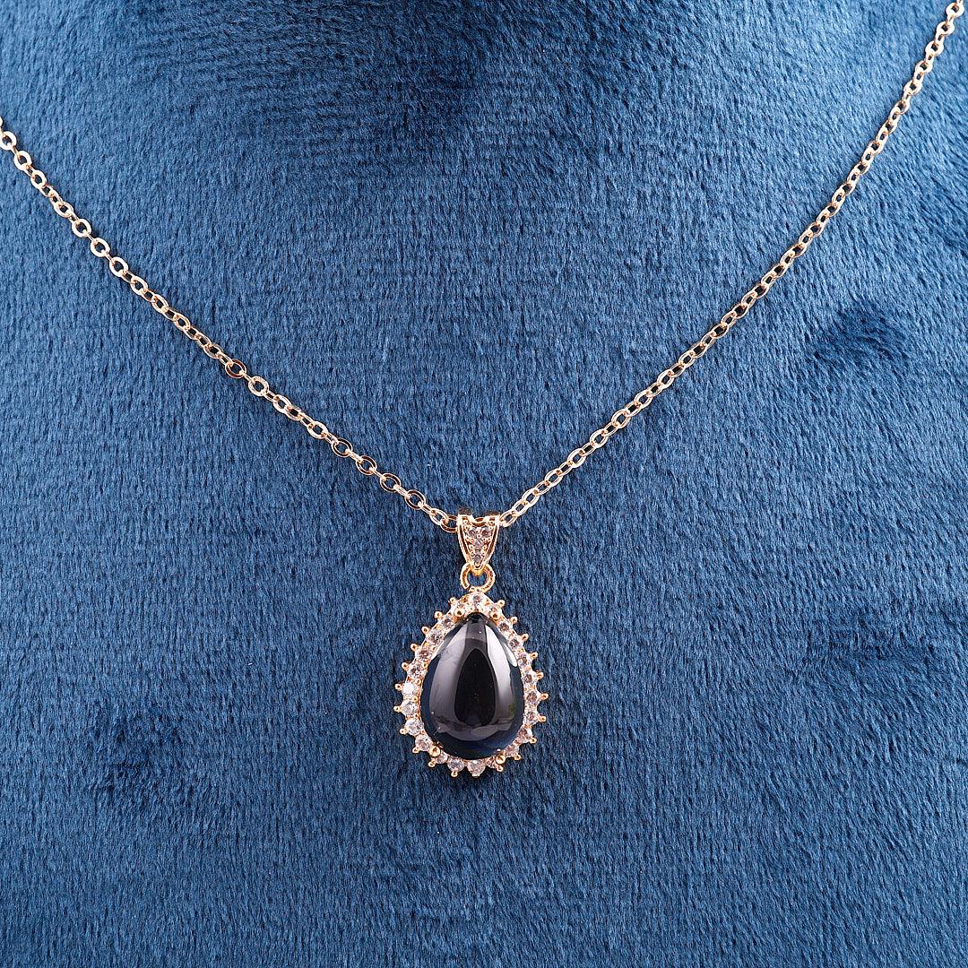 Gold-Toned Necklace with Black Teardrop Pendant