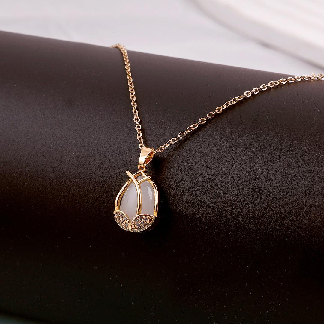 Gold Necklace with White Gemstone Pendant