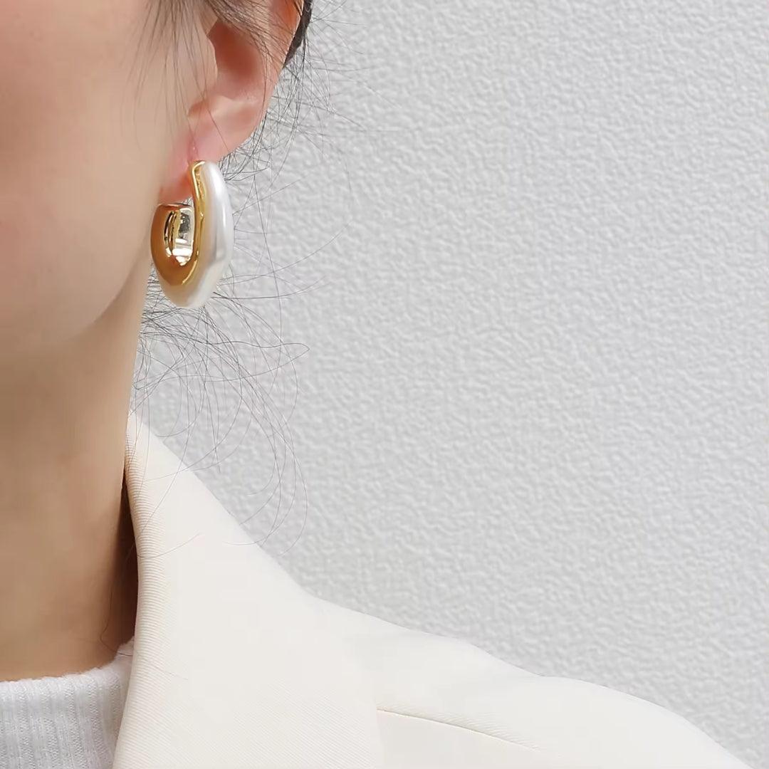 white & golden earrings