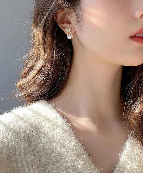 White mini bow Earning