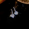 White stone heart drop earrings
