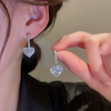 White stone heart drop earrings