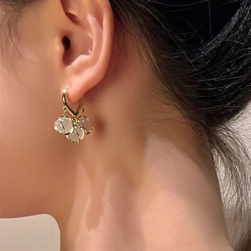 Gold-Toned Hoop Earrings with Dangling White Stone Charms