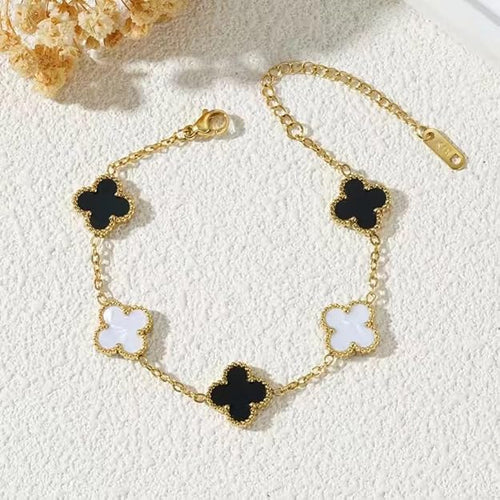 White and black bracelet with golden chain