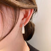 White hoop earrings