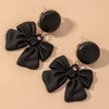 Black bow motif earring