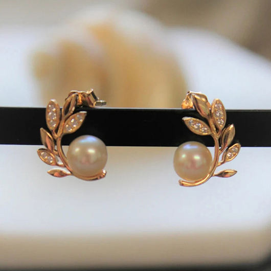 Gold plated and pearl leaf earring