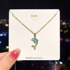 Golden chain and blue dolphin necklace