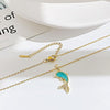 Golden chain and blue dolphin necklace